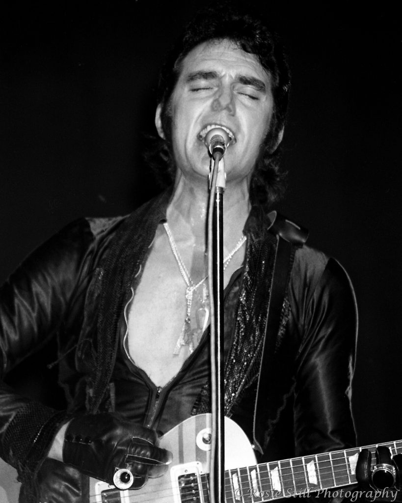 1974 A black & white photo of singer Alvin Stardust 'live' on stage in Lewisham, South East London.
