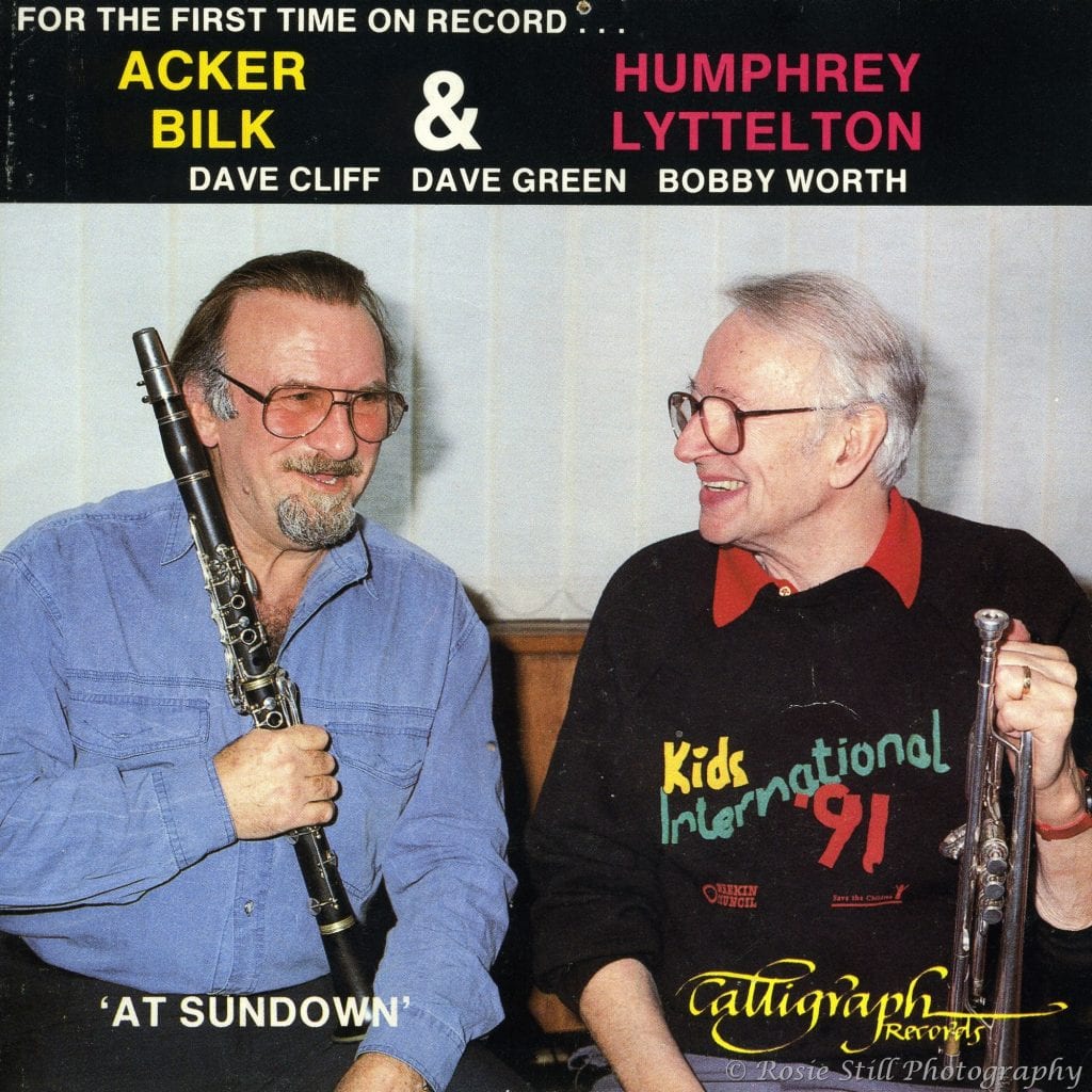 1992 Cover of the album "At Sundown" showing Jazz musicians Acker Bilk and Humphrey Lyttelton relaxing and sharing a joke in Porcupine studios