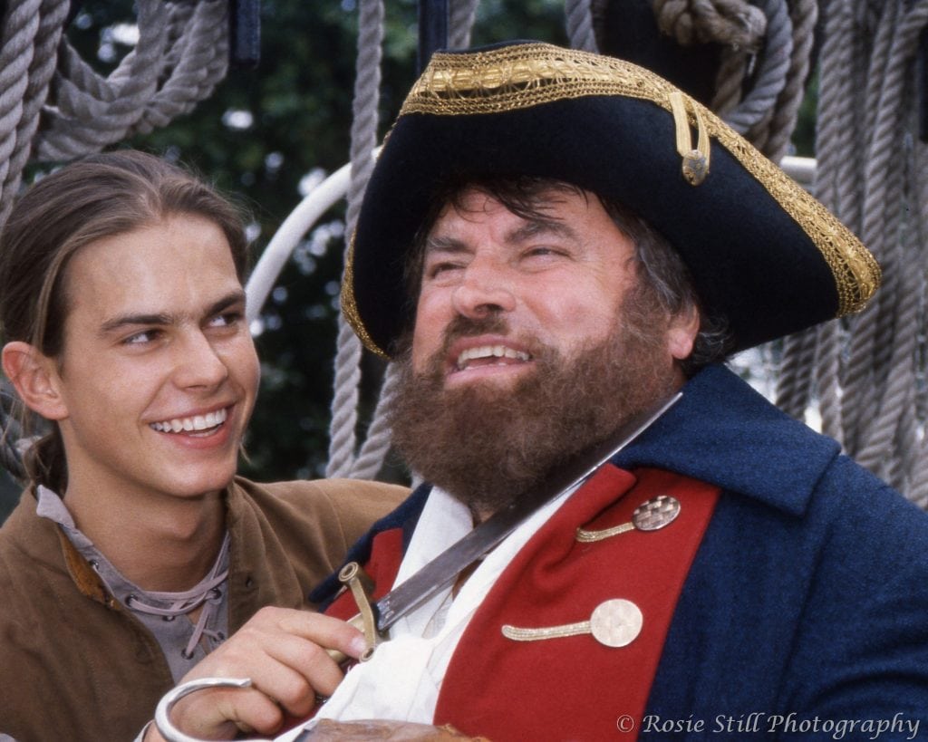 1992 Colour photo of actors Kristian Schmid (Neighbours) & Brian Blessed on the Cutty Sark in panto costumes as Peter Pan and Captain Hook