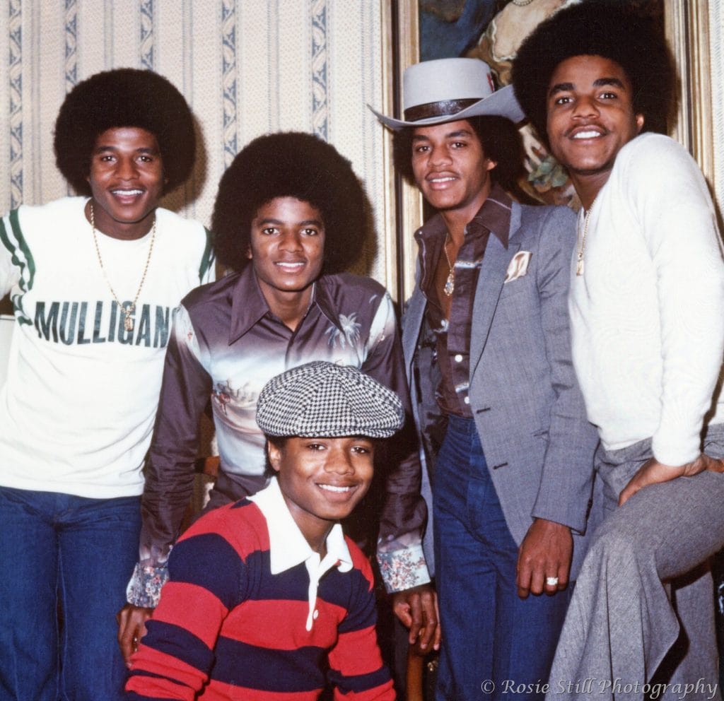 1977 Colour photo of The Jacksons taken in 1977. The line-up includes Jackie, Michael, Marlon, Tito and seated, Randy.